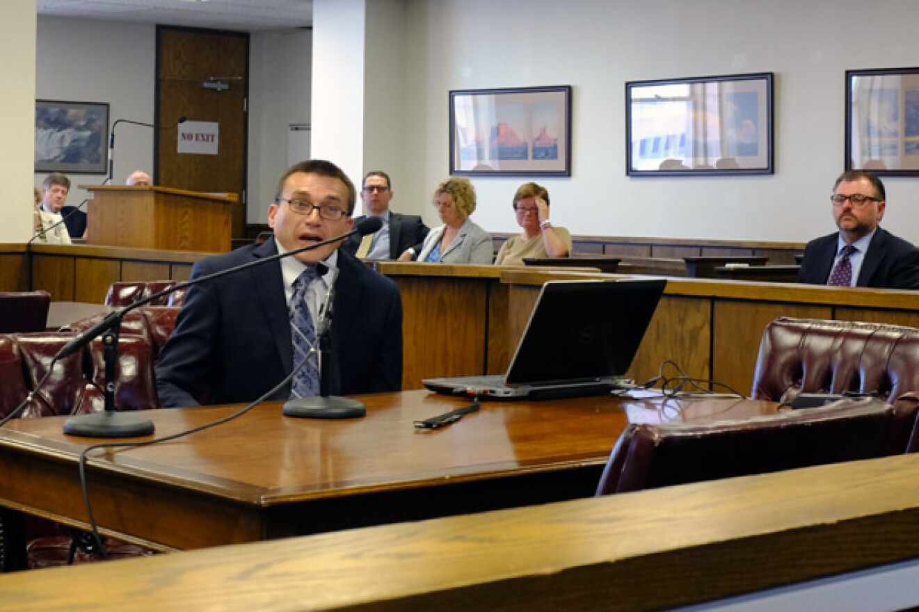Austin Holland with the Oklahoma Geological Survey briefs Corporation Commissioners on new earthquake research.